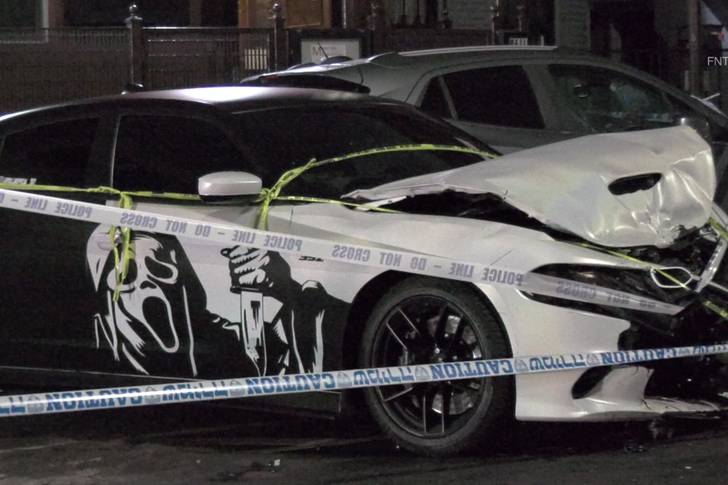 The Dodge Charger involved in the collision has a vinyl decal of the "Ghostface" from Scream
